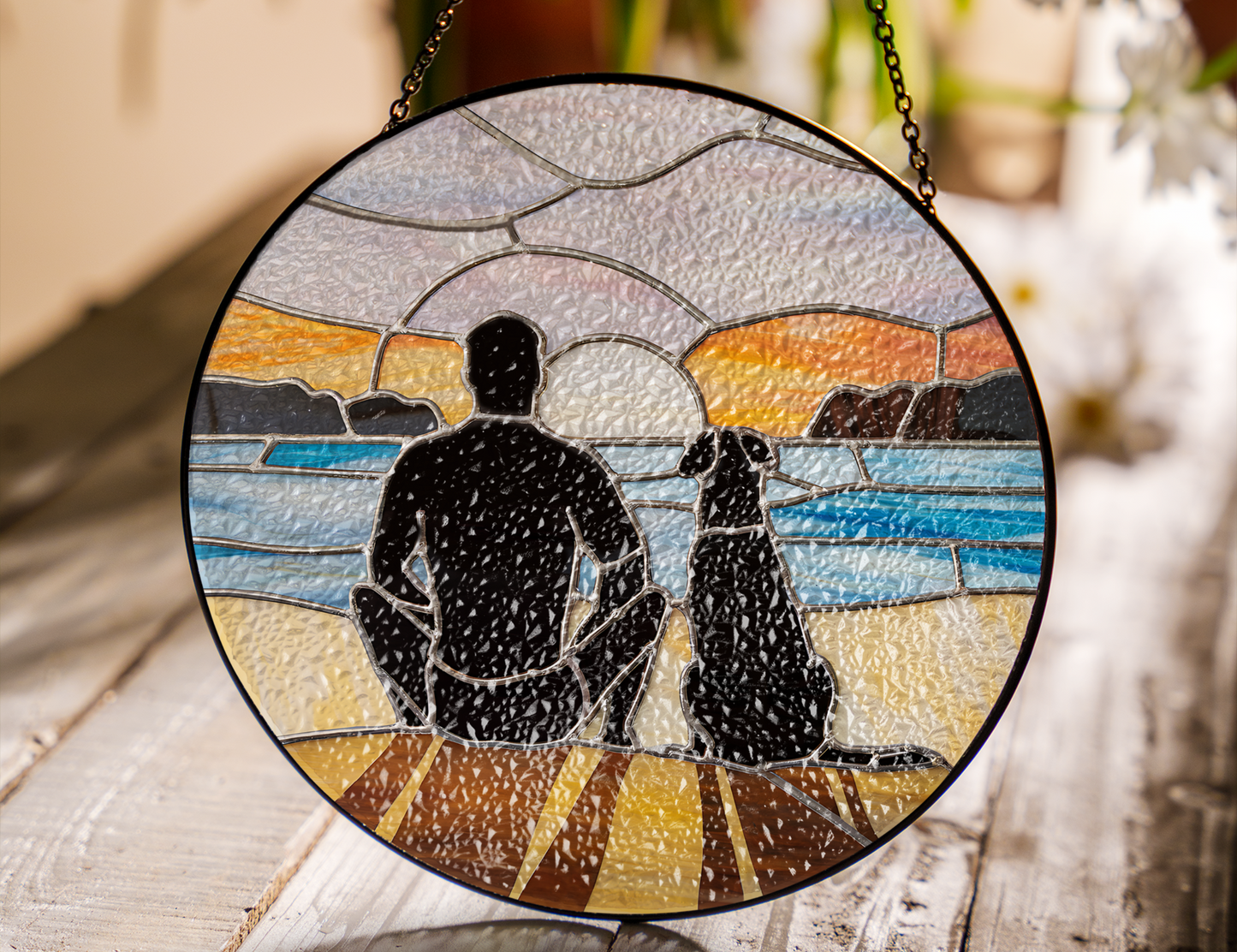 man and dog at beach at sunrise suncatcher