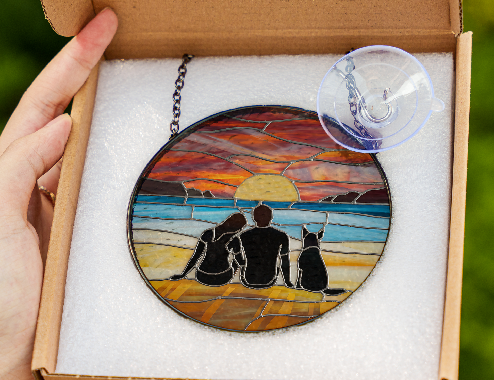 couple and dog at beach at sunset suncatcher in packaging