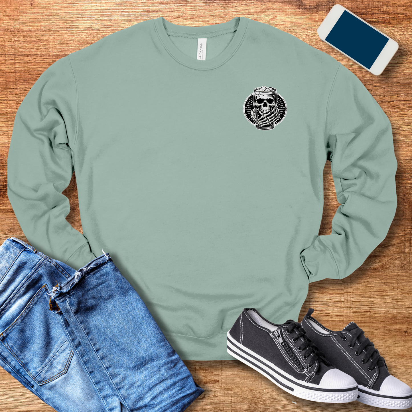 skeleton hand pocket design on front of sweatshirt in dusty blue