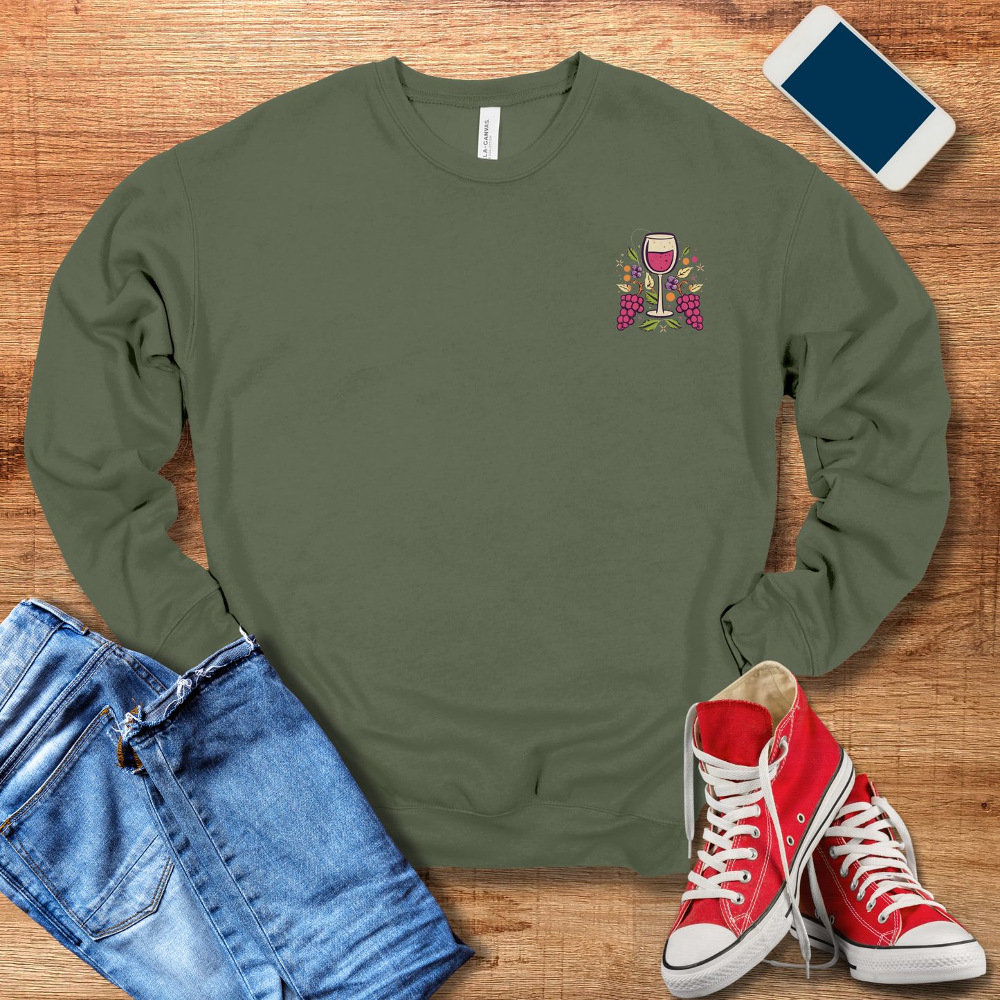 front pocket design of wine glass on military green crewneck sweatshirt