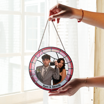 personalized photo suncatcher hanging in front of window