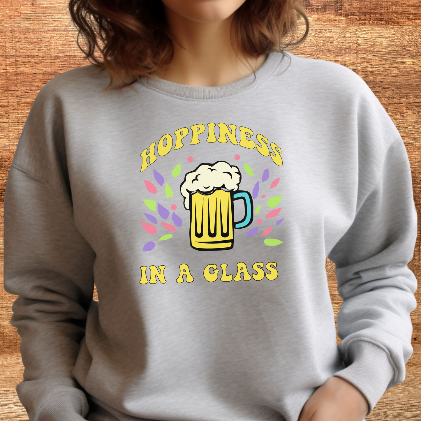 female model wearing hoppiness in a glass beer crewneck sweatshirt in heather dust color