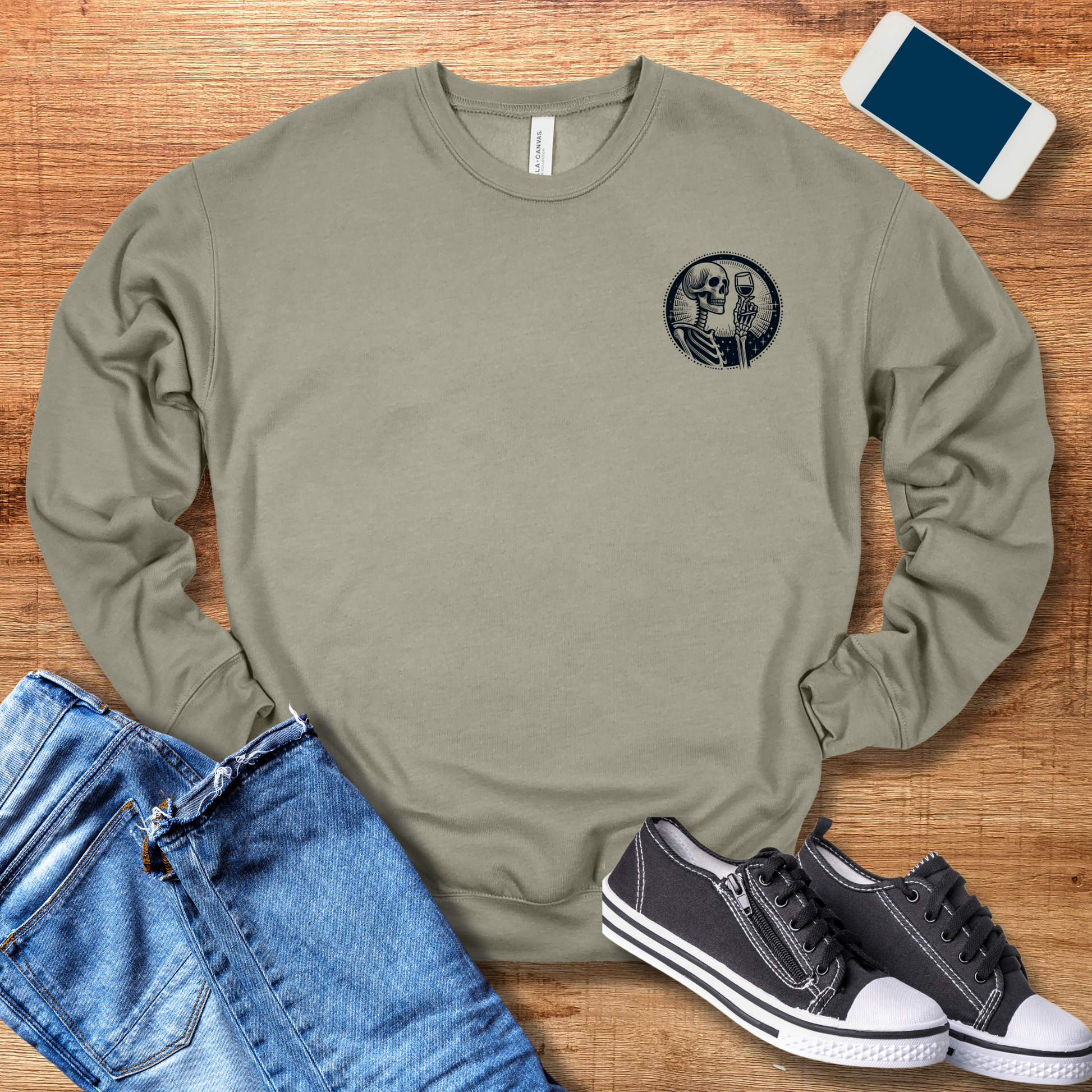 front pocket design of skeleton and wine glass in color heather stone sweatshirt