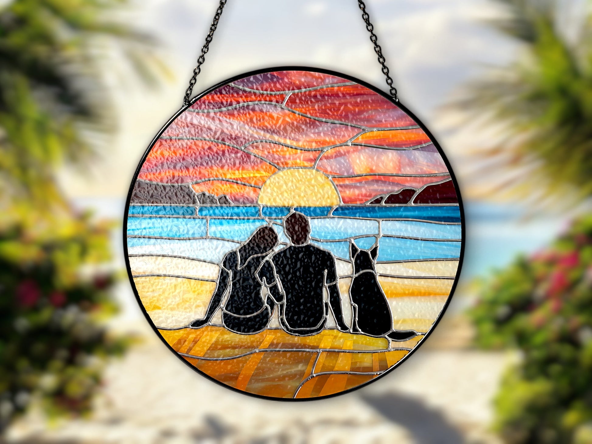 couple and dog at beach at sunset suncatcher at the beach