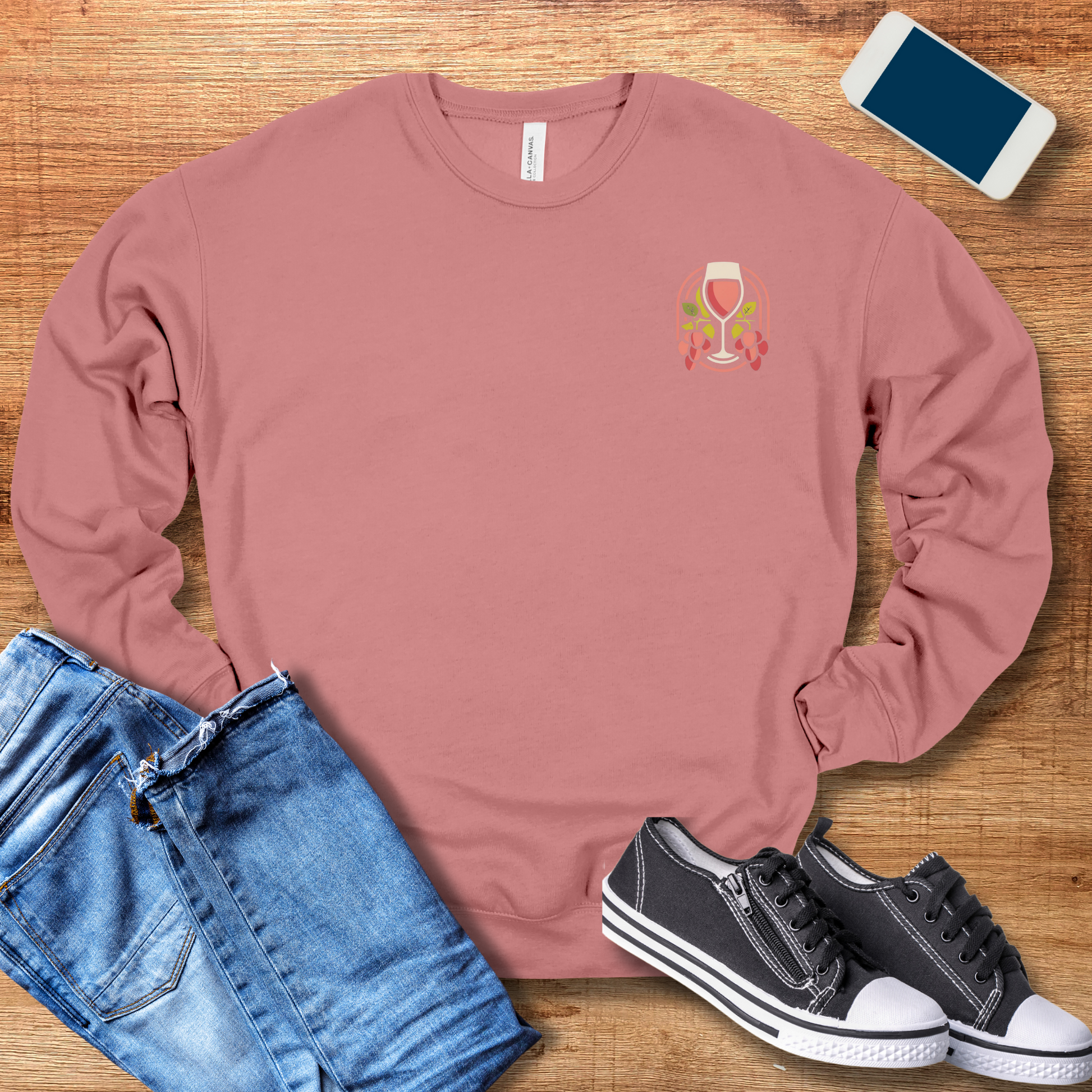 wine glass on front of mauve color sweatshirt