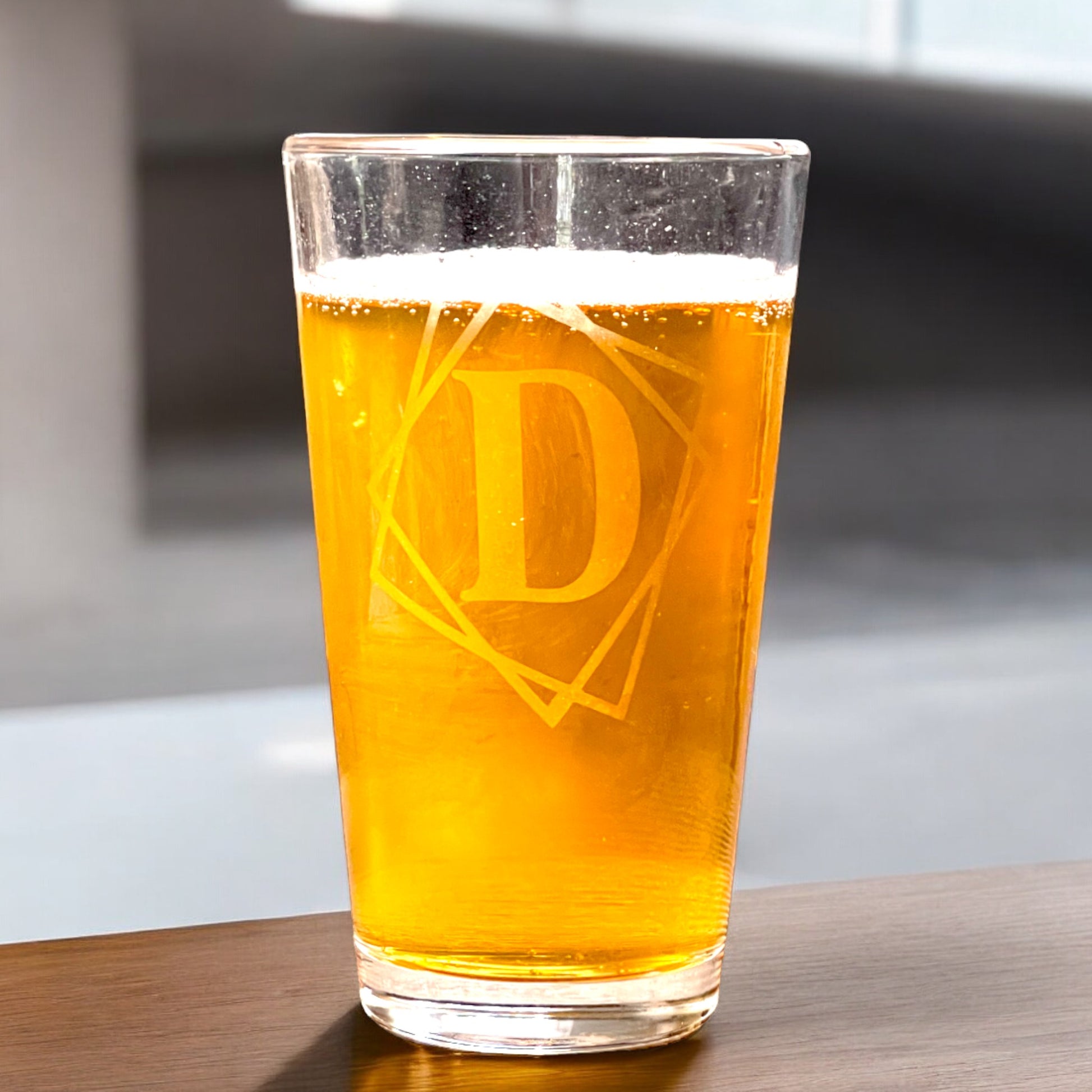 personalized pint glass with framed initial filled with beer